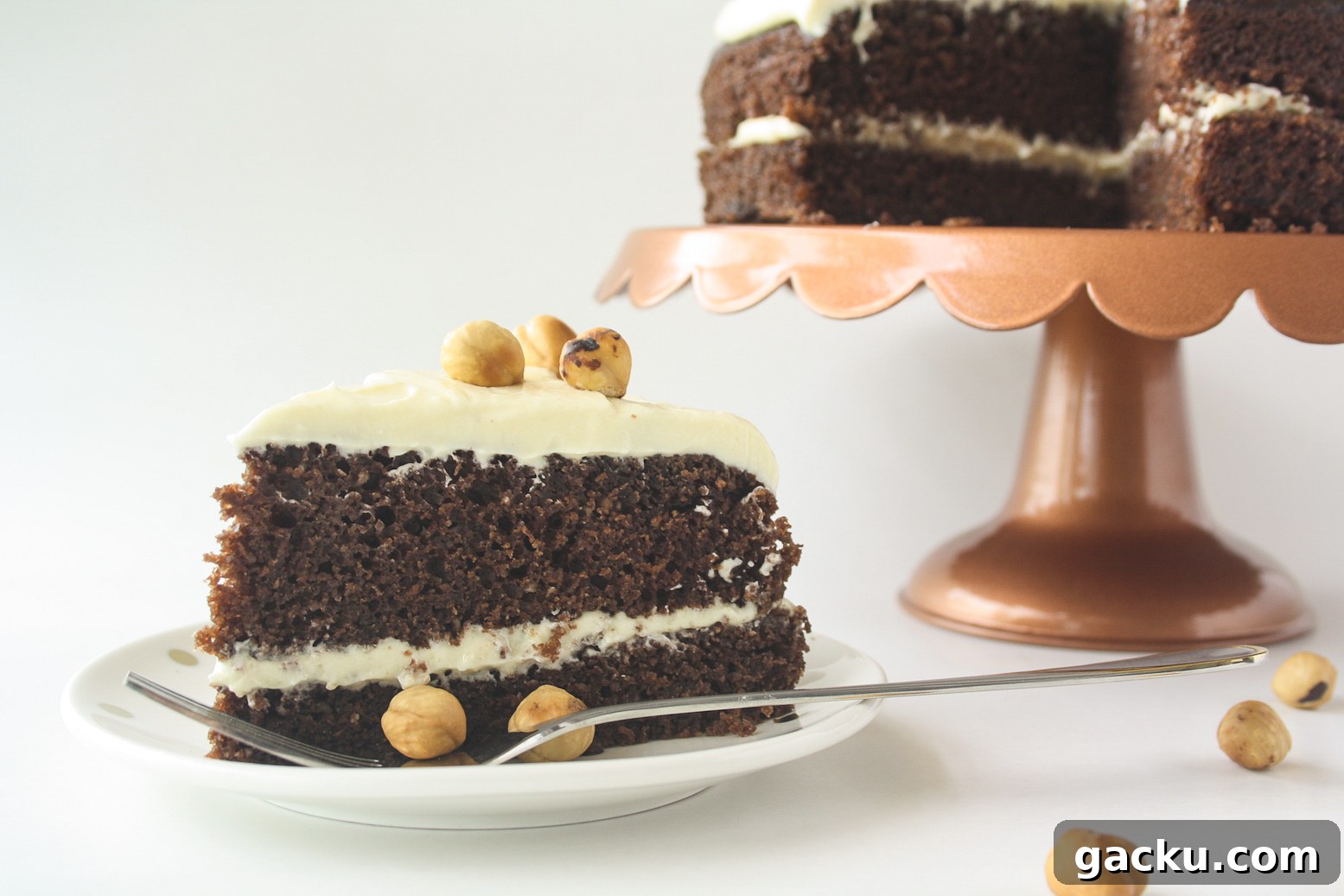 Decadent Chocolate Hazelnut Layer Cake Recipe 2 Moist chocolate cake filled with hazelnuts, layered with a hazelnut cream cheese frosting!