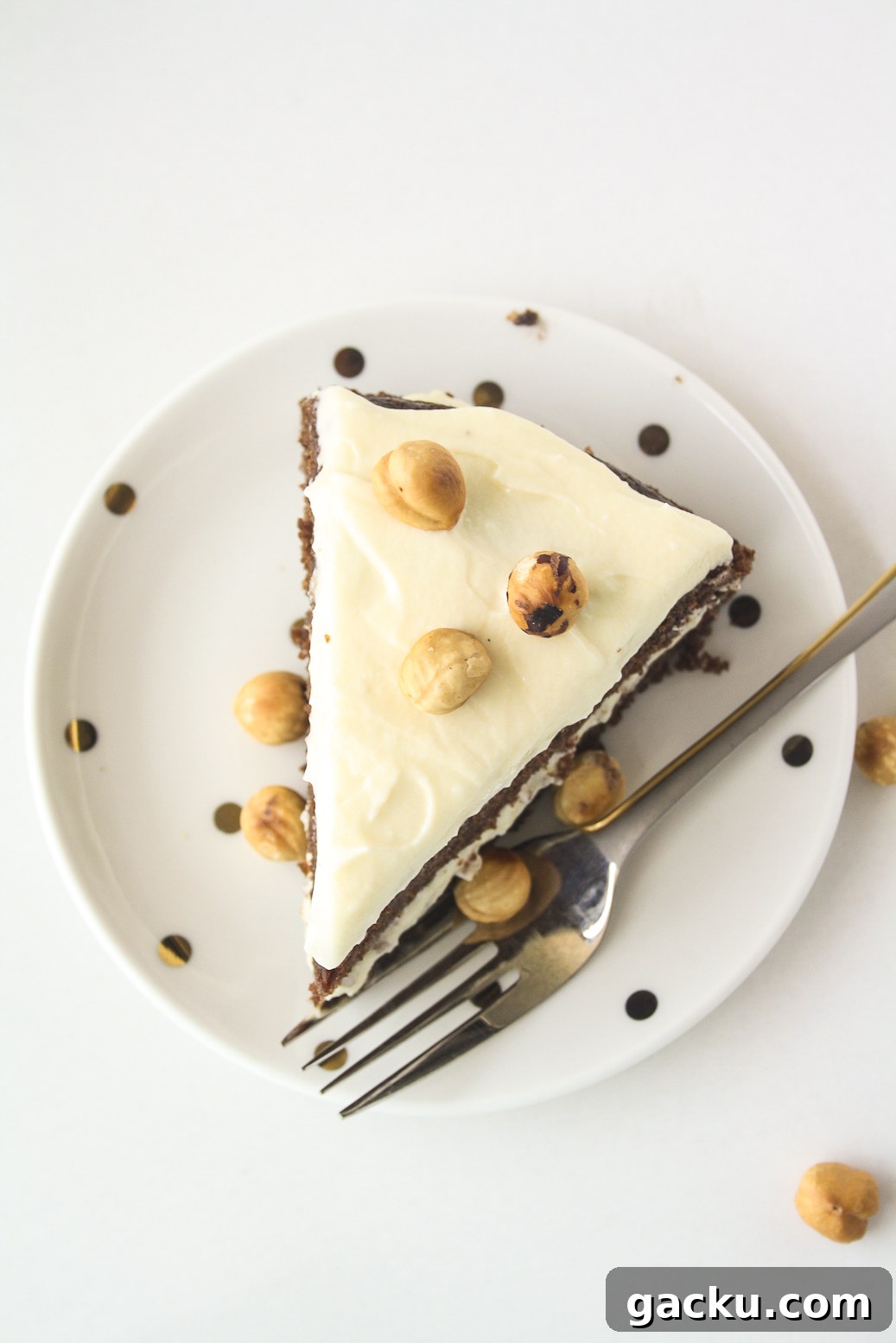 Decadent Chocolate Hazelnut Layer Cake Recipe 3 Moist chocolate cake filled with hazelnuts, layered with a hazelnut cream cheese frosting!