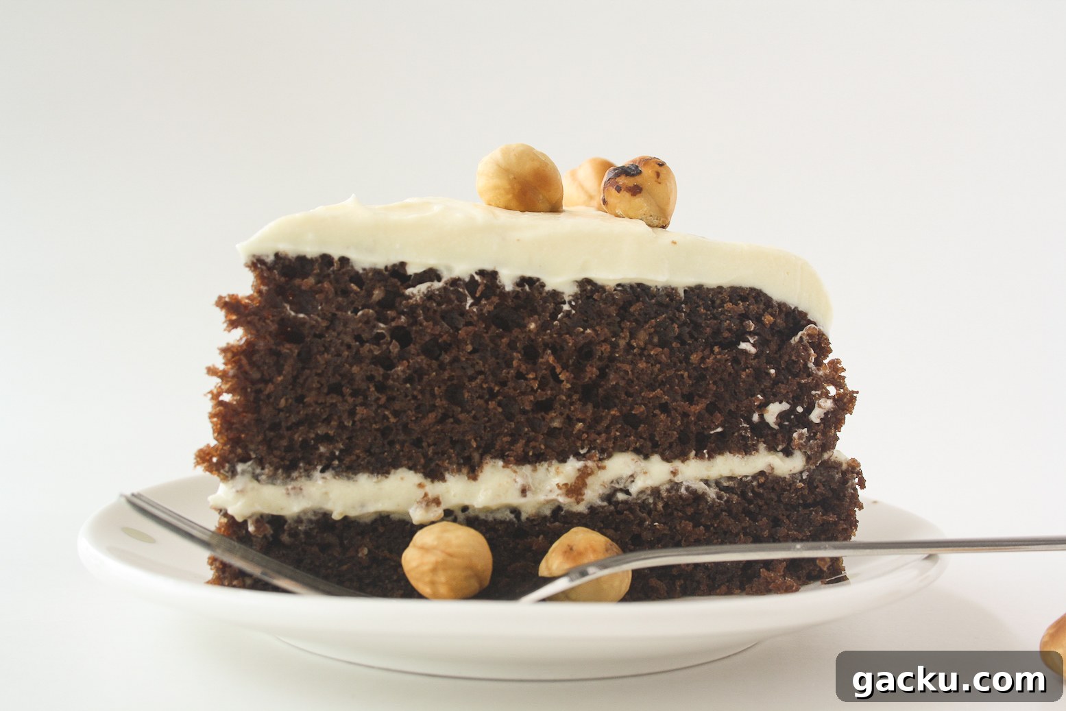 Decadent Chocolate Hazelnut Layer Cake Recipe 6 Moist chocolate cake filled with hazelnuts, layered with a hazelnut cream cheese frosting!