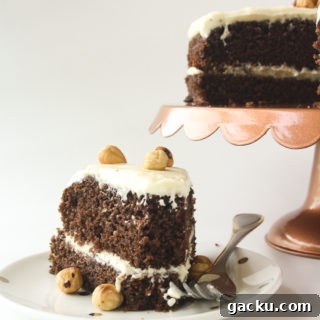 Moist chocolate cake filled with hazelnuts, layered with a hazelnut cream cheese frosting!