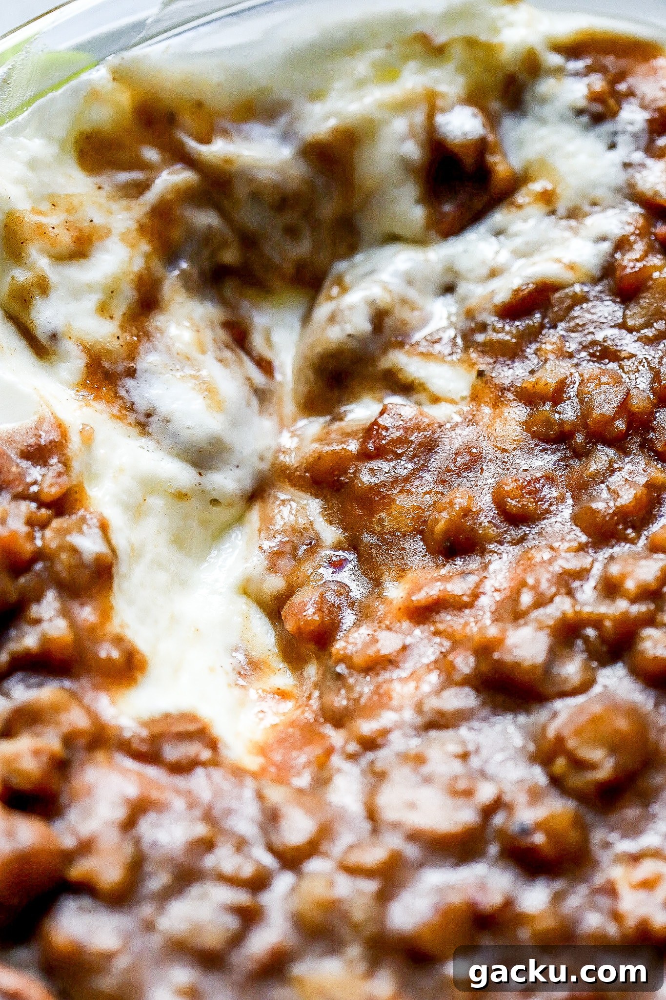 Close up shot of easy pecan pie dip with a caramel layer on top.