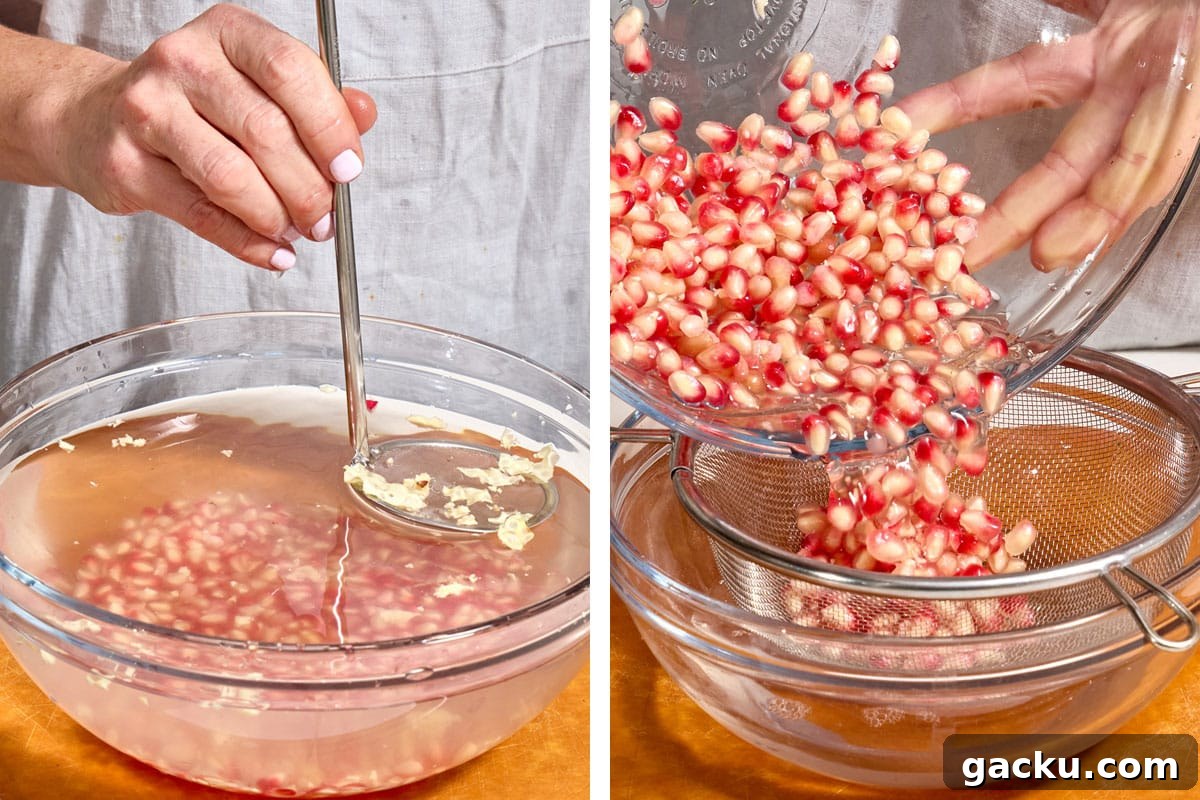 Straining fresh pomegranate arils from water.