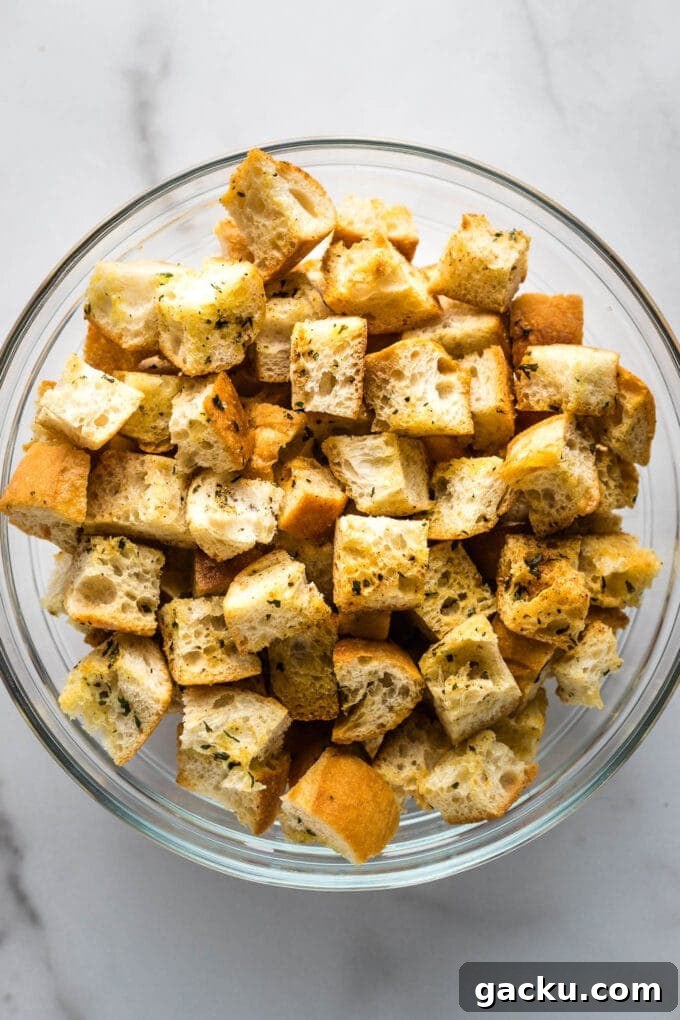 Crispy Homemade Croutons Recipe for Salads & Soups 2 Close-up of crunchy croutons in a prep bowl.