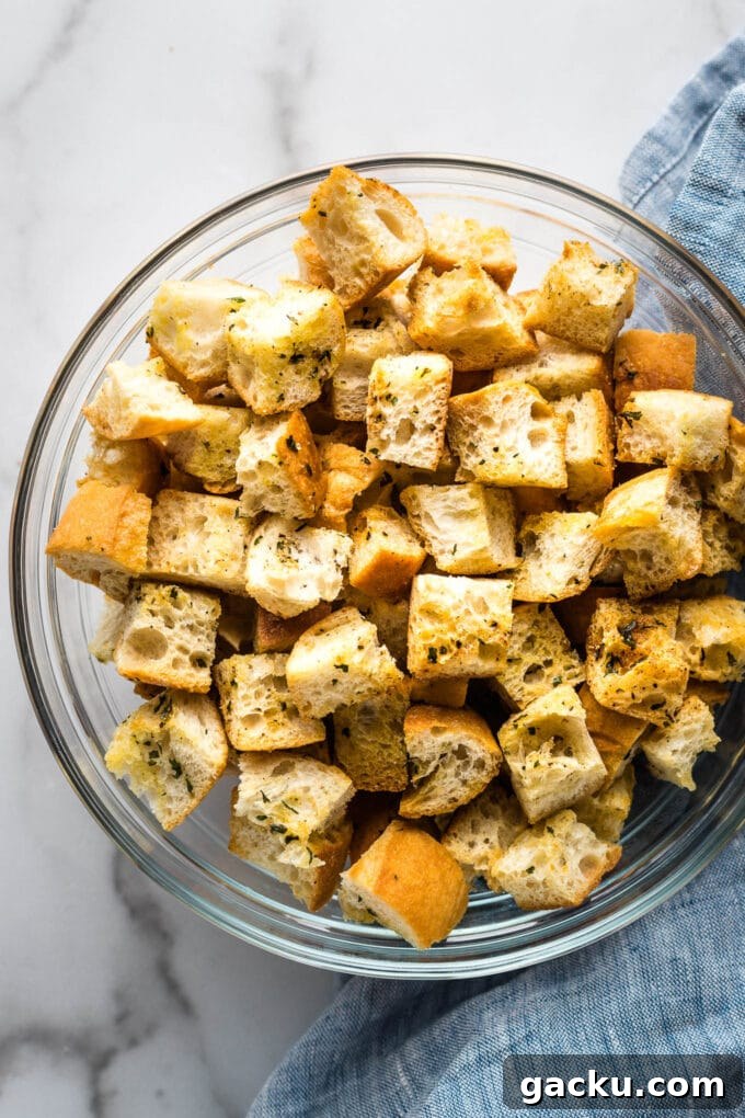 Crispy Homemade Croutons Recipe for Salads & Soups 7 Crunchy homemade croutons in a clear bowl.