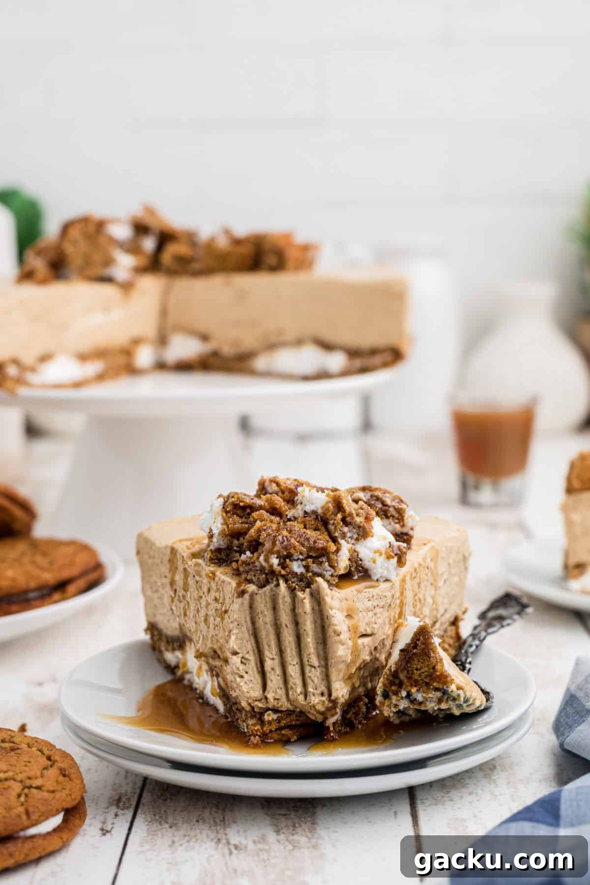 A slice of oatmeal creme pie cheesecake with a fork mark through the front.
