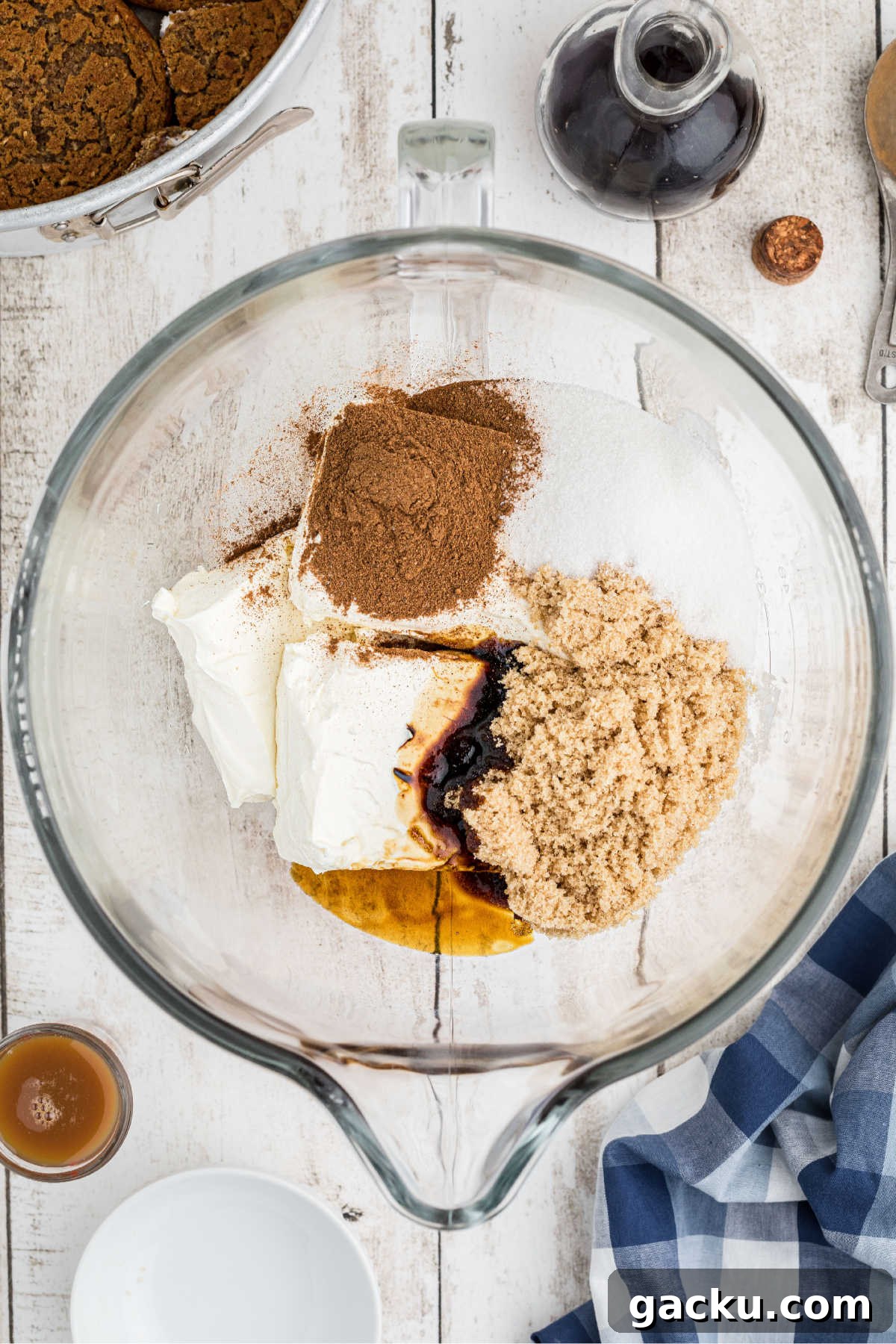 A mixing bowl filled with sugar and cinnamon etc.