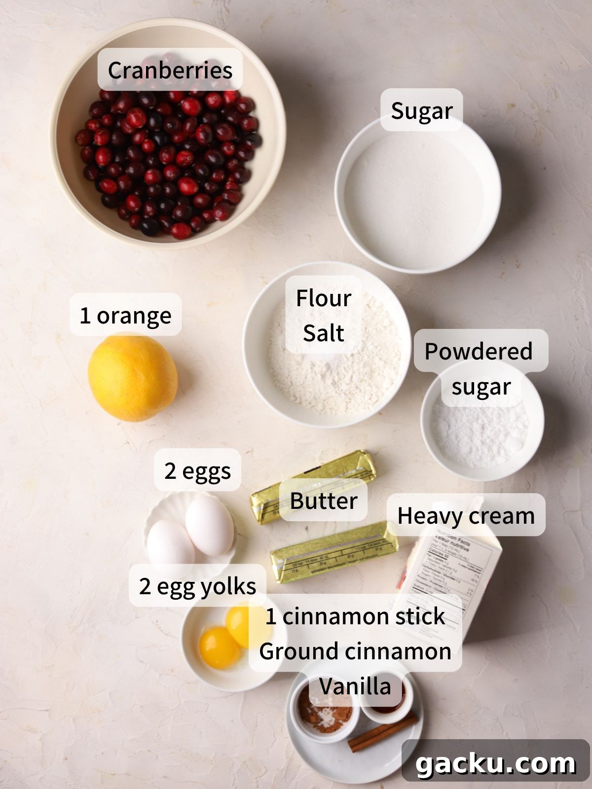 Labeled ingredients needed to make cranberry curd tart laid out on a table.