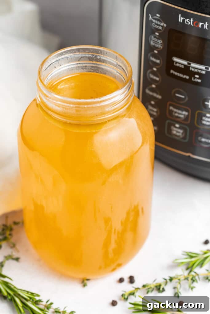 instant pot turkey stock in a jar in front of the instant pot