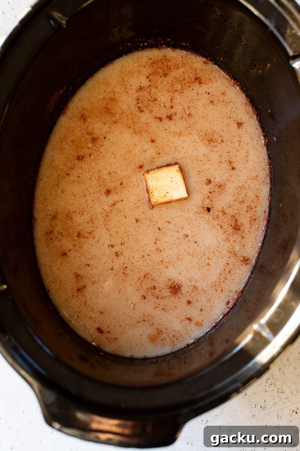 milk and butter added to a slow cooker