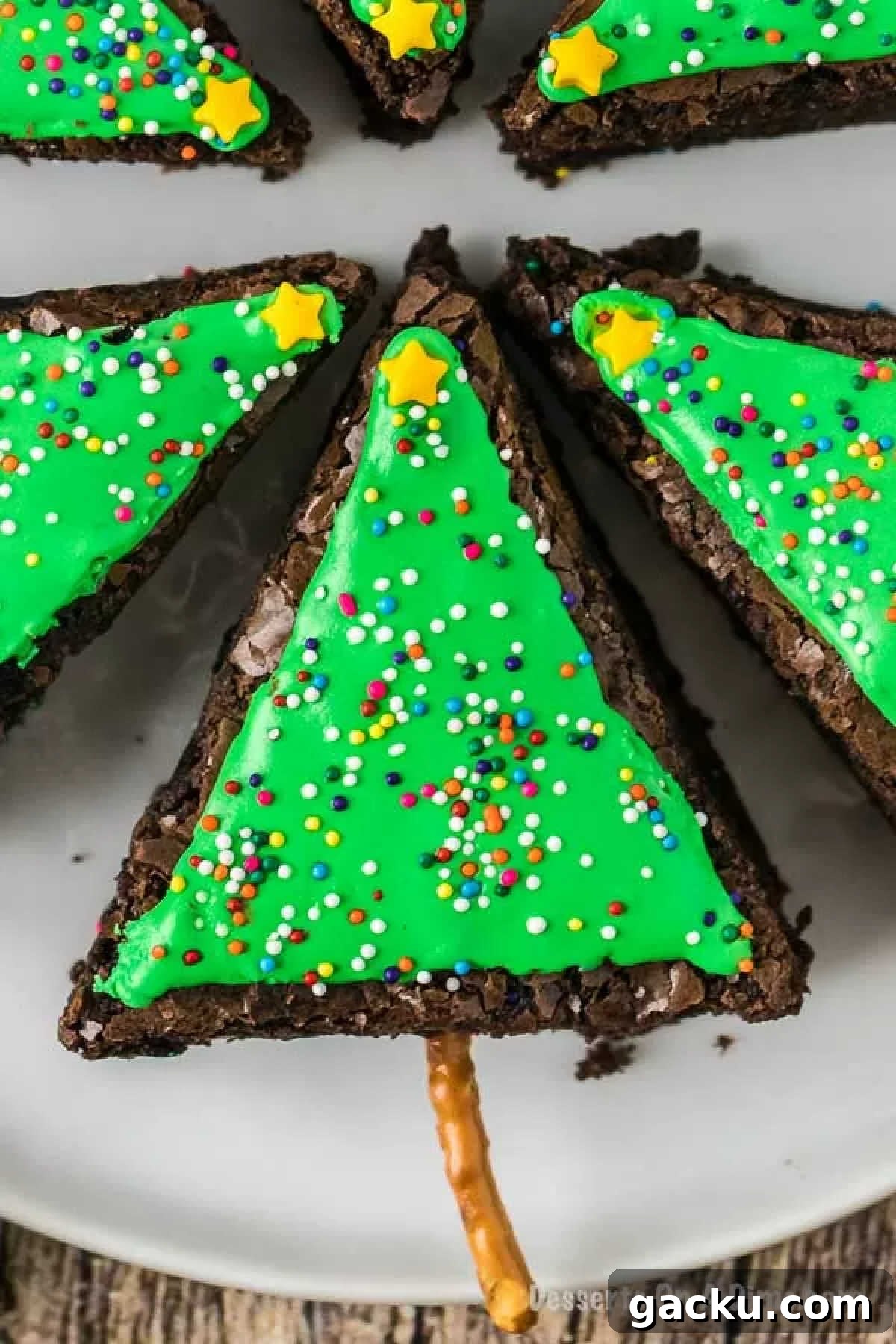 Christmas Tree Brownie Recipe: Festive Layered Chocolate Treat 6 Sprinkles on brownies and decorated as a tree.
