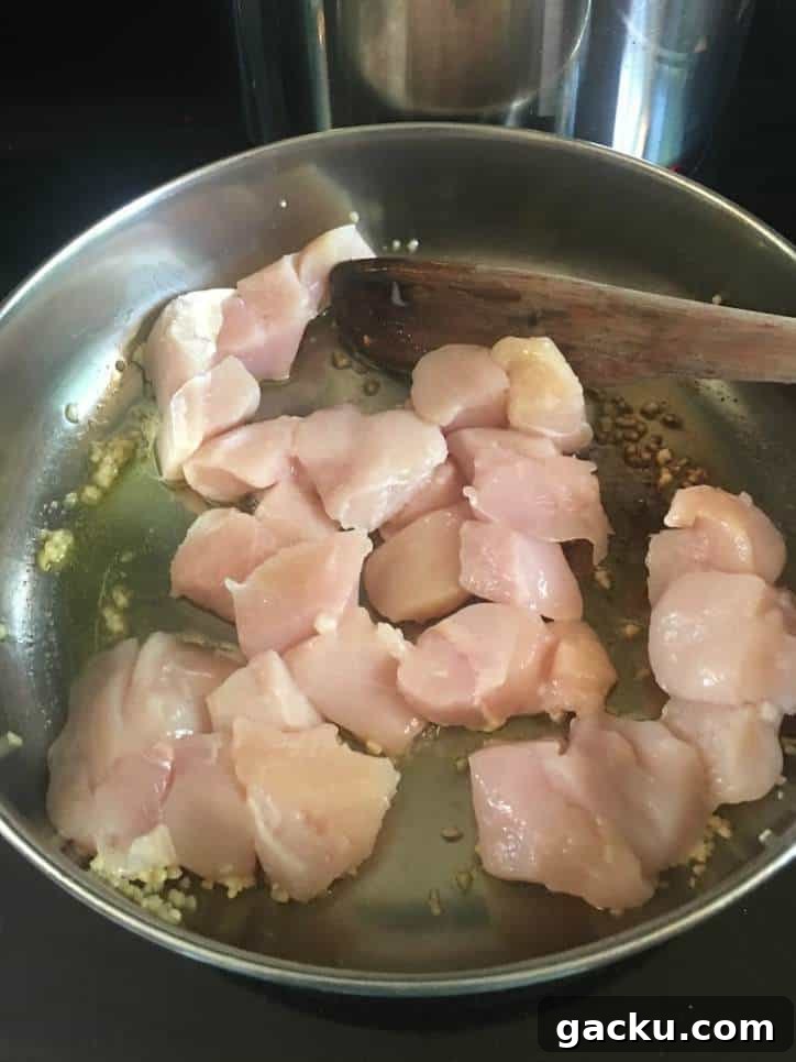 A photo of the chicken cooking in the pan