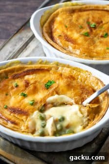Ultimate Creamy Chicken Pot Pie Recipe for Comforting Weeknight Meals 9 Creamy Chicken Pot Pie in individual dishes.