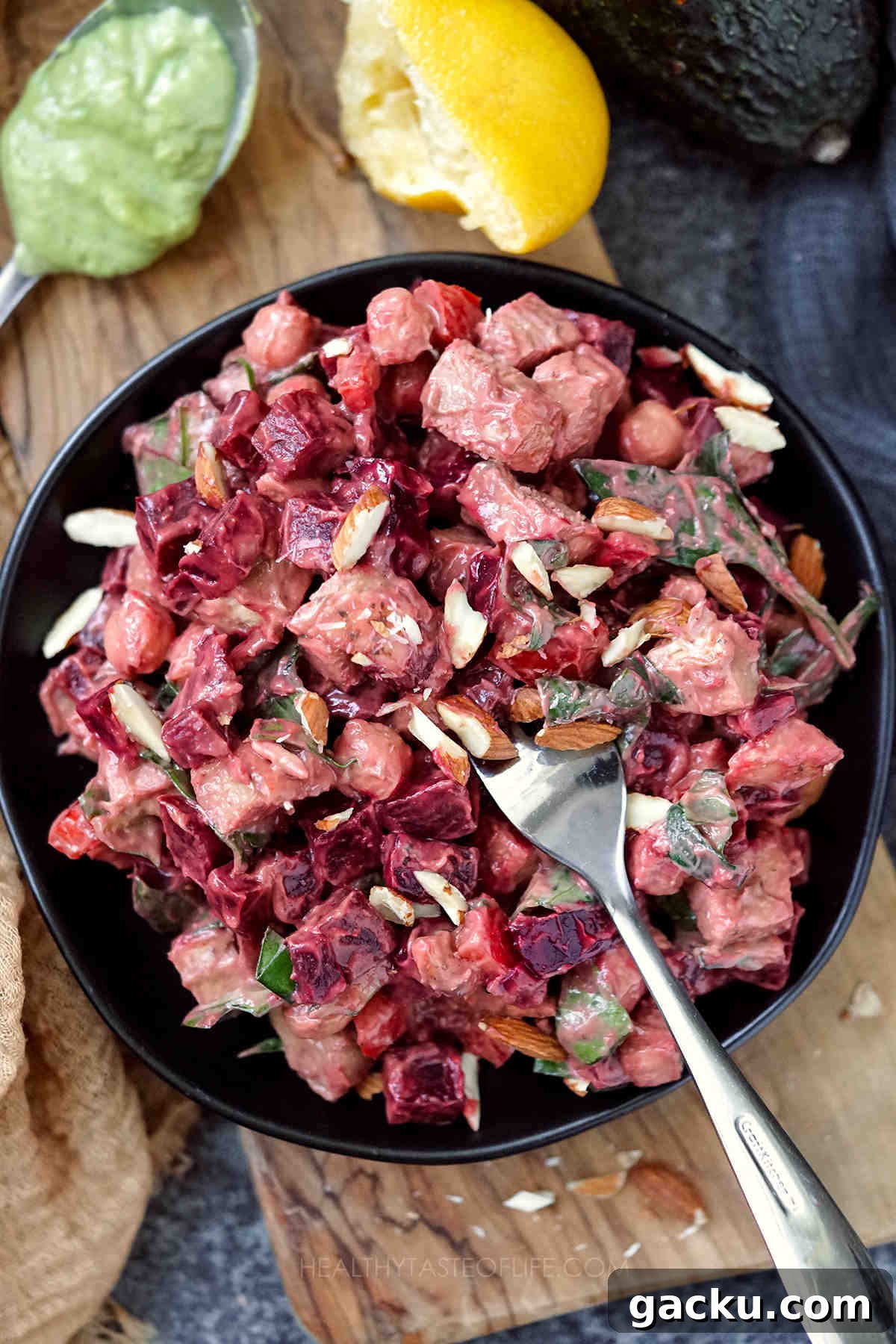 Over head shot of assembled and served Chicken Beet Salad with Avocado Dressing.