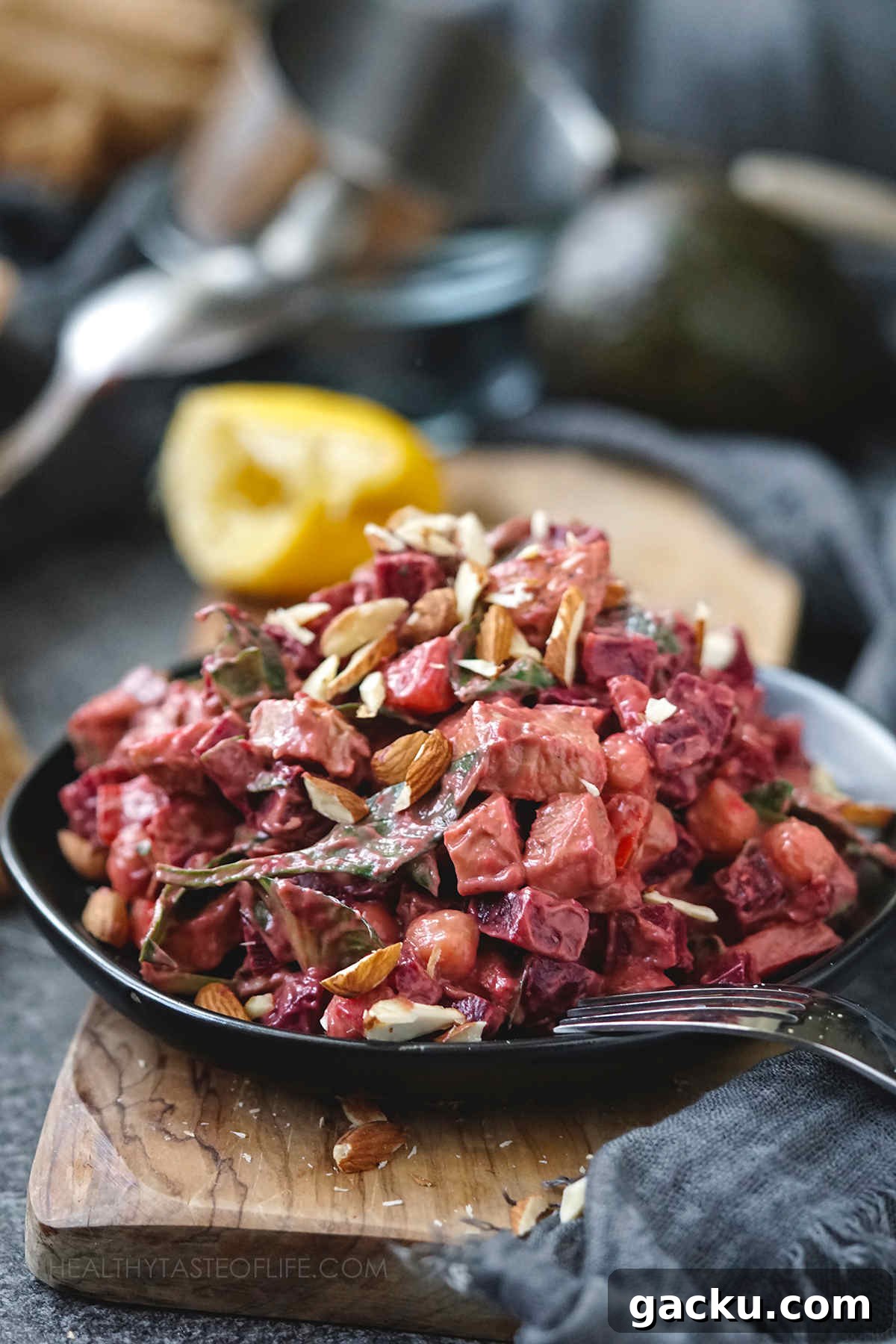 High-Protein Beet Salad With Chicken ready to be served on a plate.