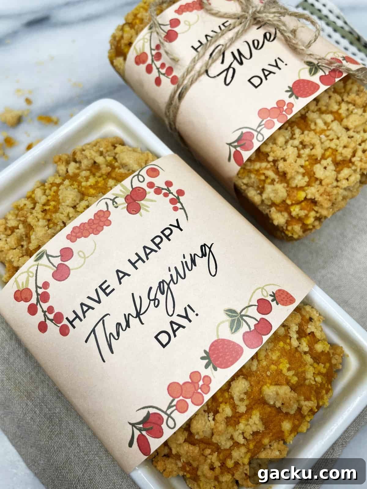 Pumpkin Streusel Quick Bread Recipe for Fall Baking 3 Wrapped mini pumpkin bread loaves.
