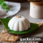 close up cropped image of coconut pudding on banana leaf for recipe card