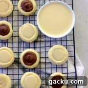condensed milk cookies arranged on a wire rack