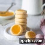 close up image of lemon curd cookies stacked