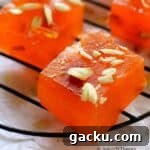 cropped up image of halwa slices placed on a wire rack