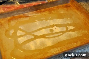 extra virgin olive oil and garlic powder on pan