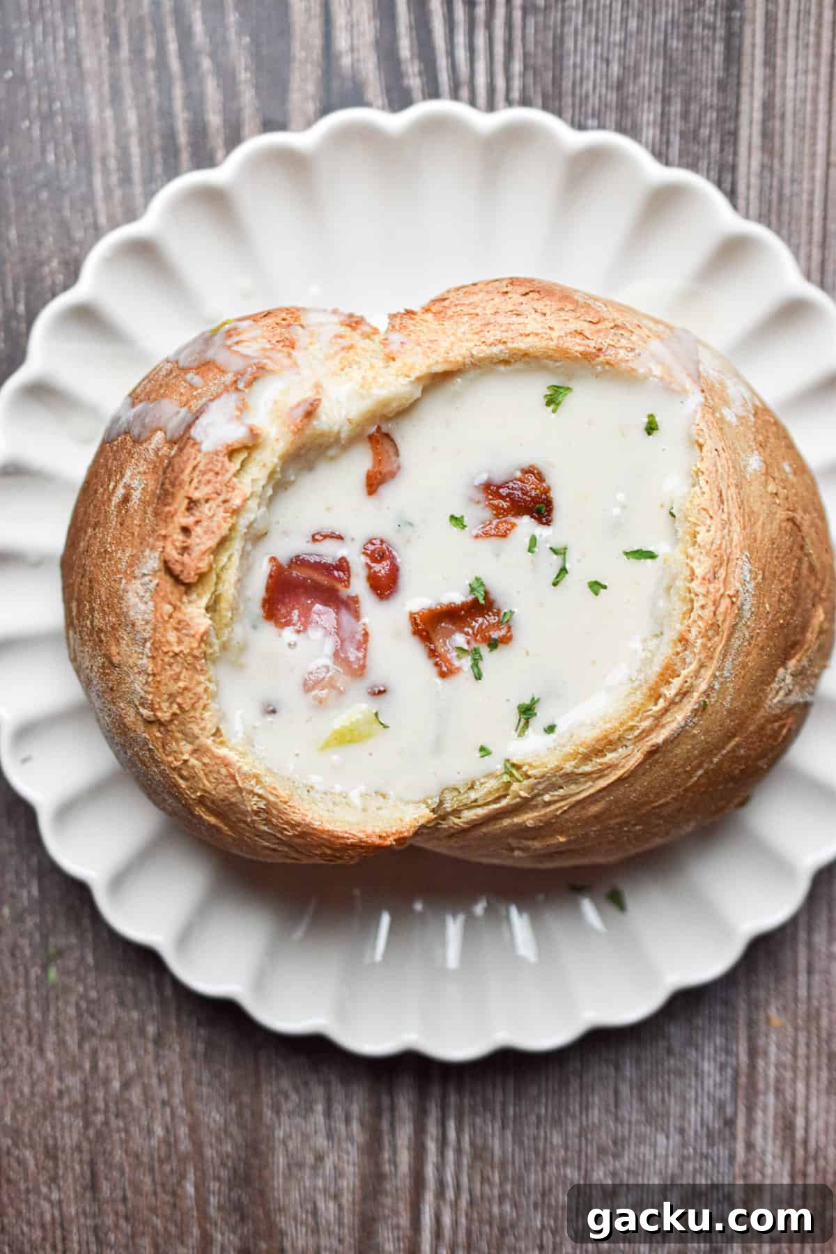 The New England Clam Chowder is in a bread bowl.
