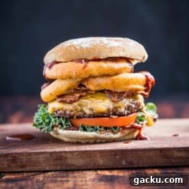 Western Cheeseburger with Onion Rings on a wood board