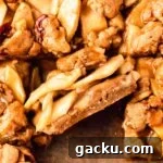 closeup of apple pie bars on parchment paper square