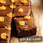 Chocolate cake with frosting and mini pumpkins