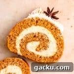 sliced pumpkin cake roll with swirl and star anise seed