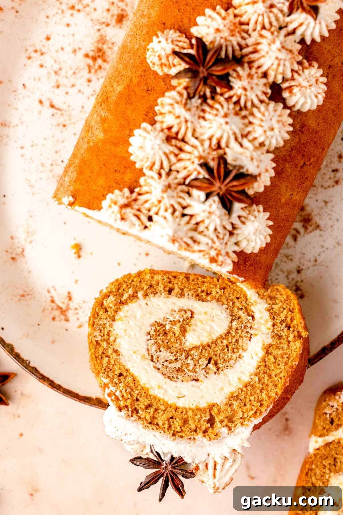 sliced pumpkin roll with piped stars on top