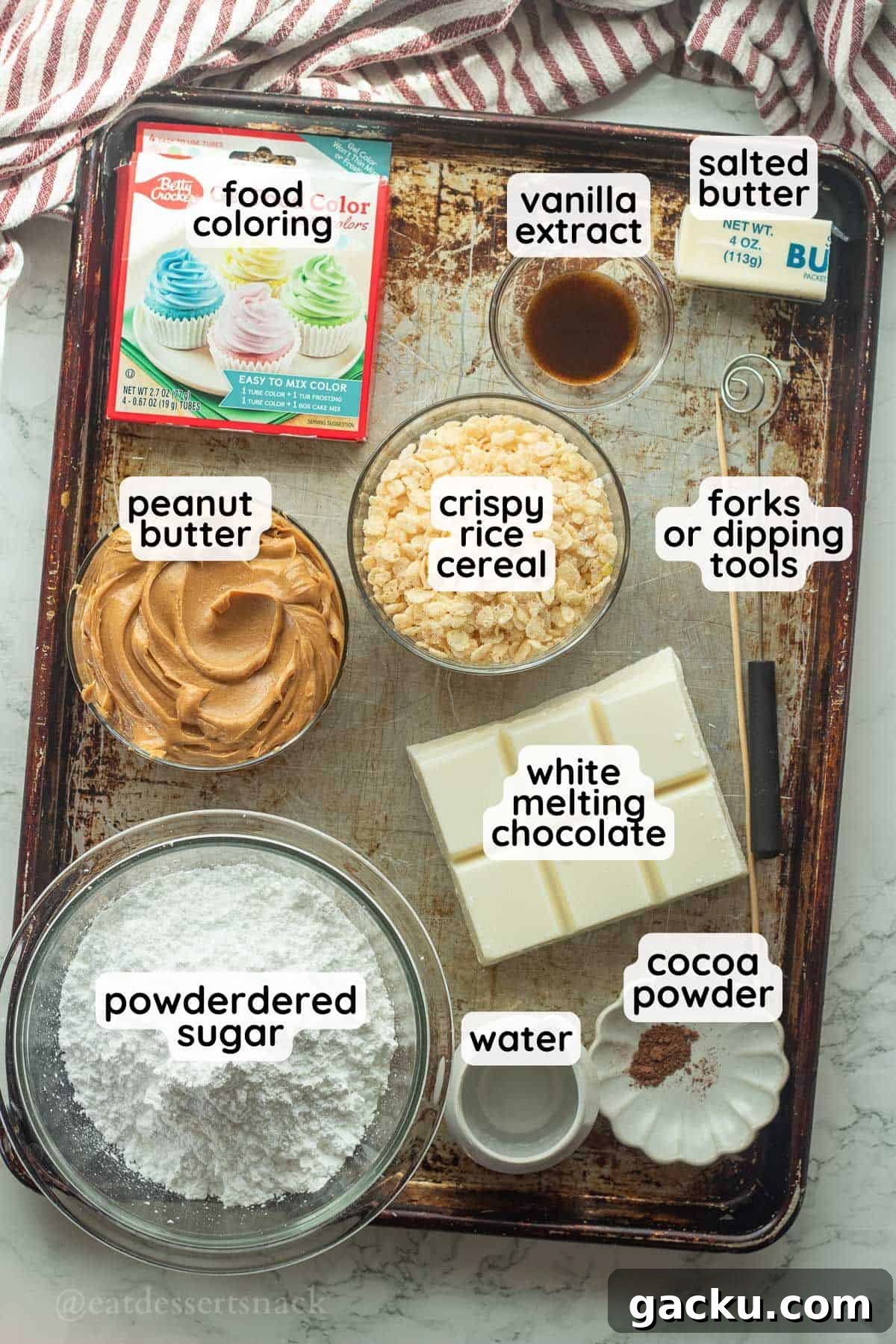 Ingredients for peanut butter easter eggs labeled on baking tray in glass bowls.