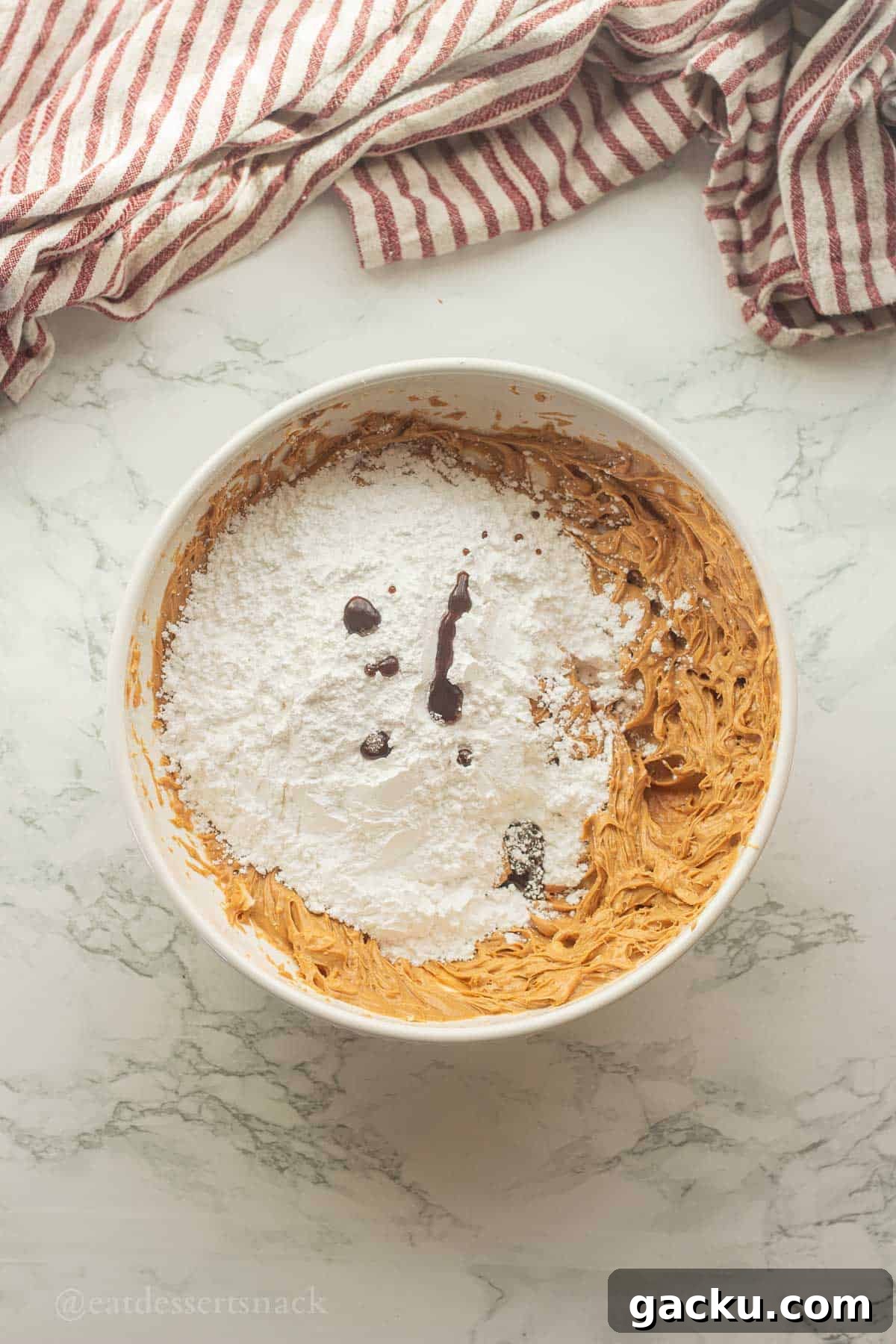 Powdered sugar and vanilla in peanut butter mixture.