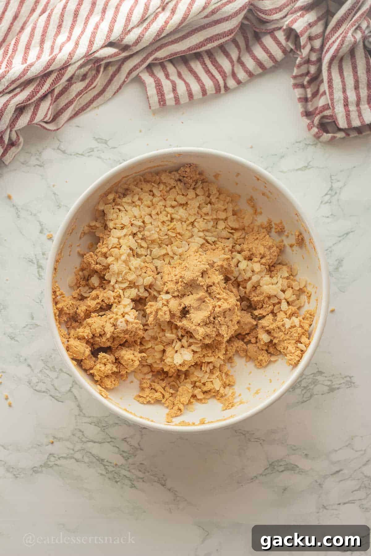 Crispy rice cereal in peanut butter mixture.