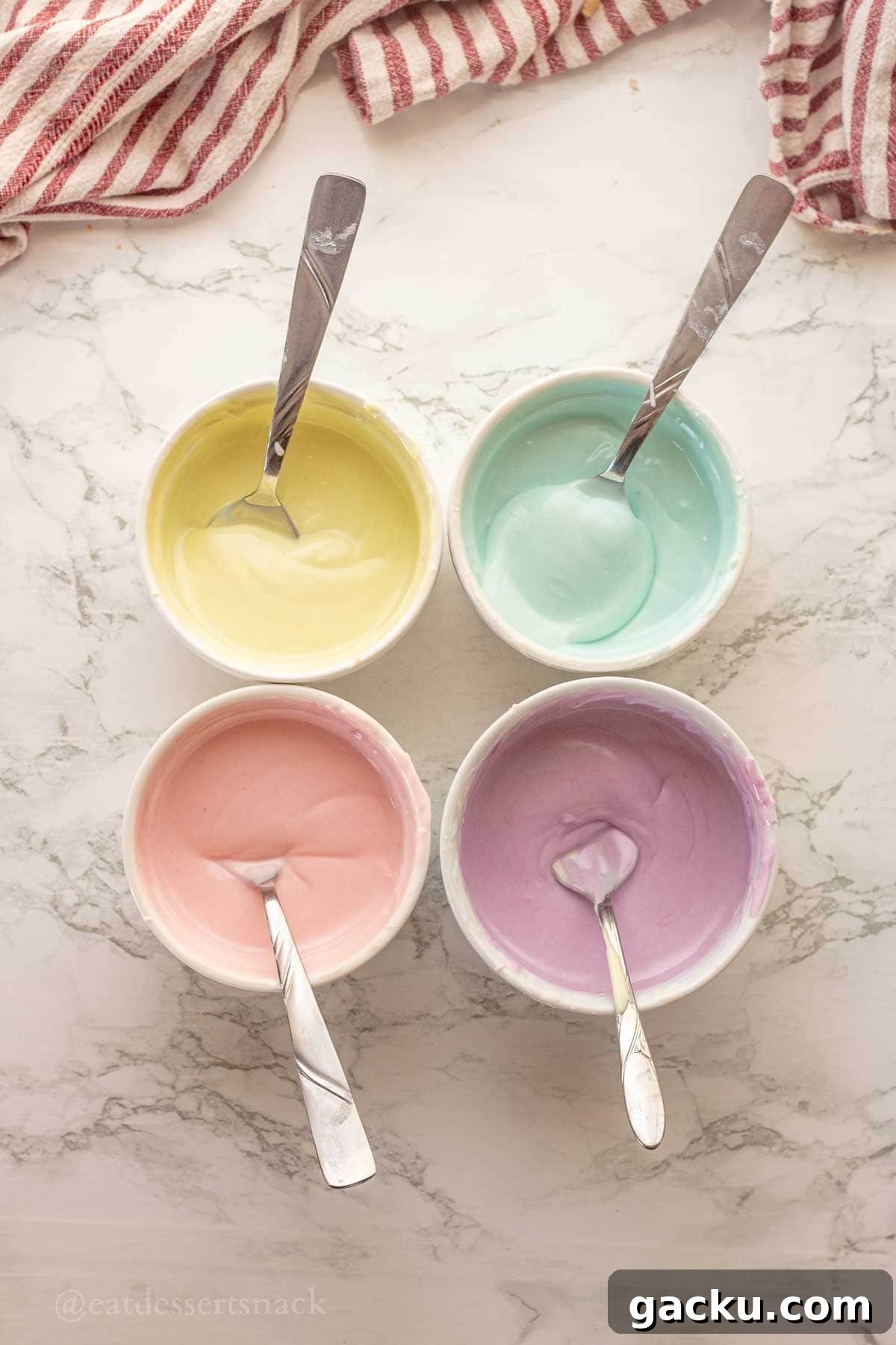 Colored chocolate for easter eggs in 4 bowls.