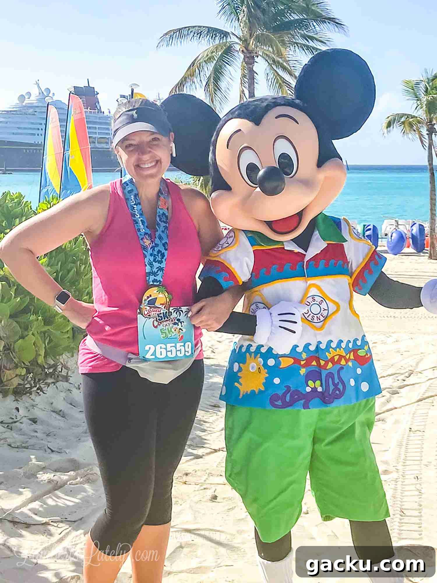 With Mickey Mouse after Castaway Cay 5k, with Disney wonder in the background.