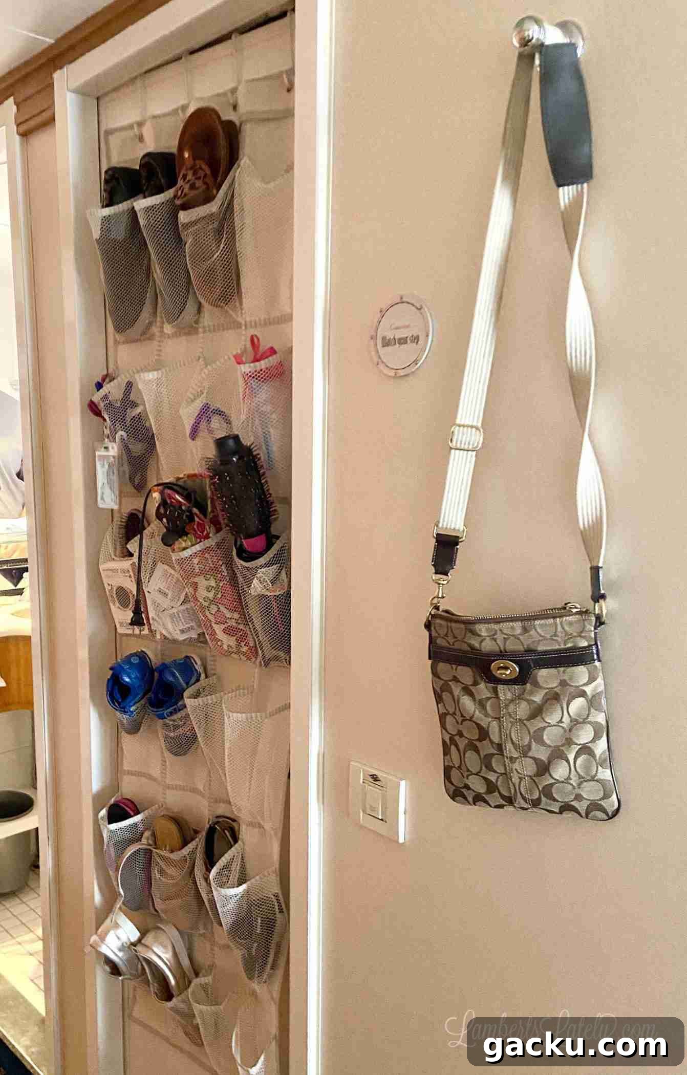 hanger holding a purse on a wall in a cabin.