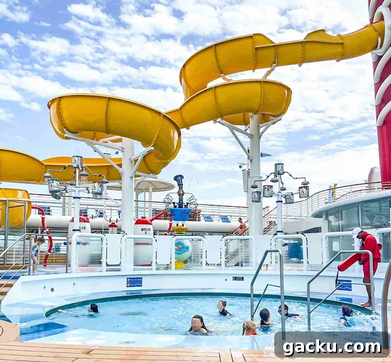 children in a pool and a lifeguard on the deck of the disney wonder cruise ship.