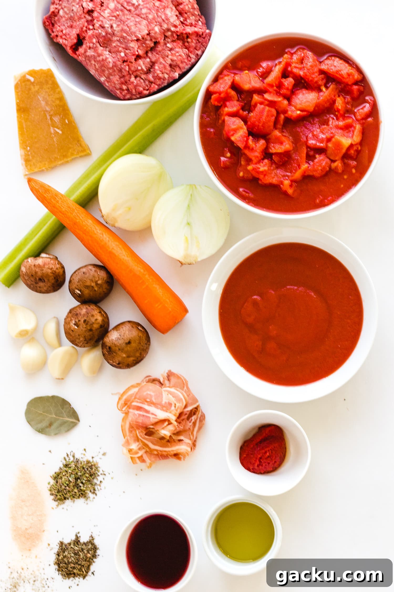 Authentic Bolognese Sauce Recipe for Rich, Slow-Simmered Pasta 3 Overhead shot of all the ingredients needed to make bolognese sauce