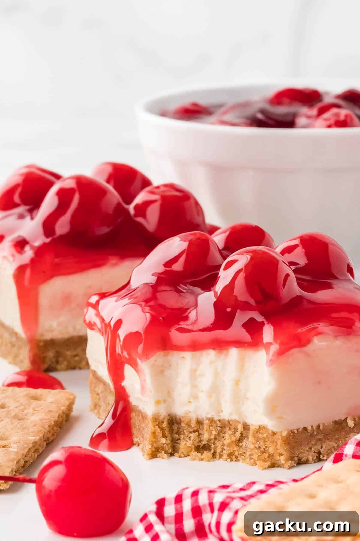 A slice of cheesecake with a bite out of it.