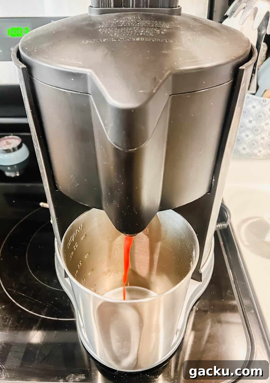 Refreshing Strawberry Iced Tea Recipe: Cool Summer Drink 4 Juicing a strawberries to make strawberry juice.
