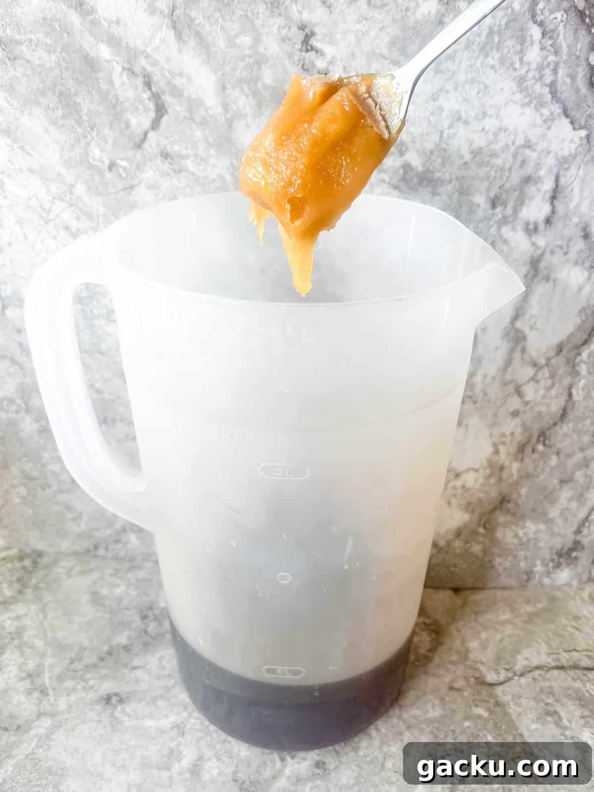 Refreshing Strawberry Iced Tea Recipe: Cool Summer Drink 6 Adding honey to strawberry iced tea.