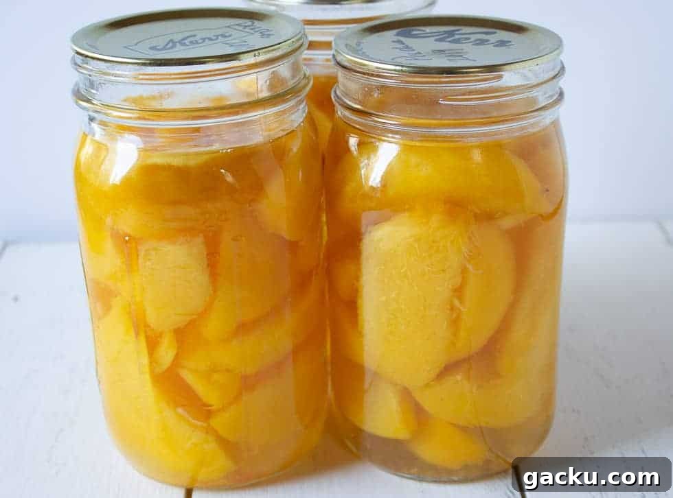 Juicy Peach Muffin Recipe for Perfect Summer Breakfast 3 Quart jars filled with peaches.