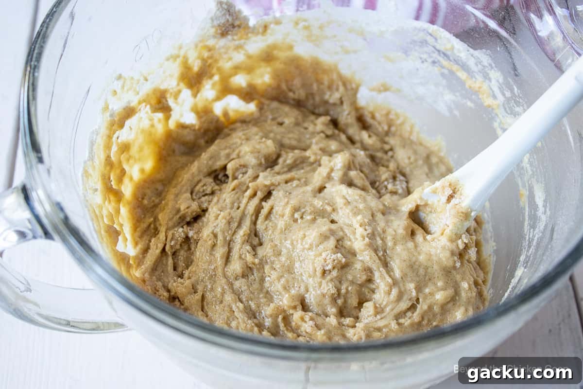 Juicy Peach Muffin Recipe for Perfect Summer Breakfast 7 Muffin batter in a bowl.