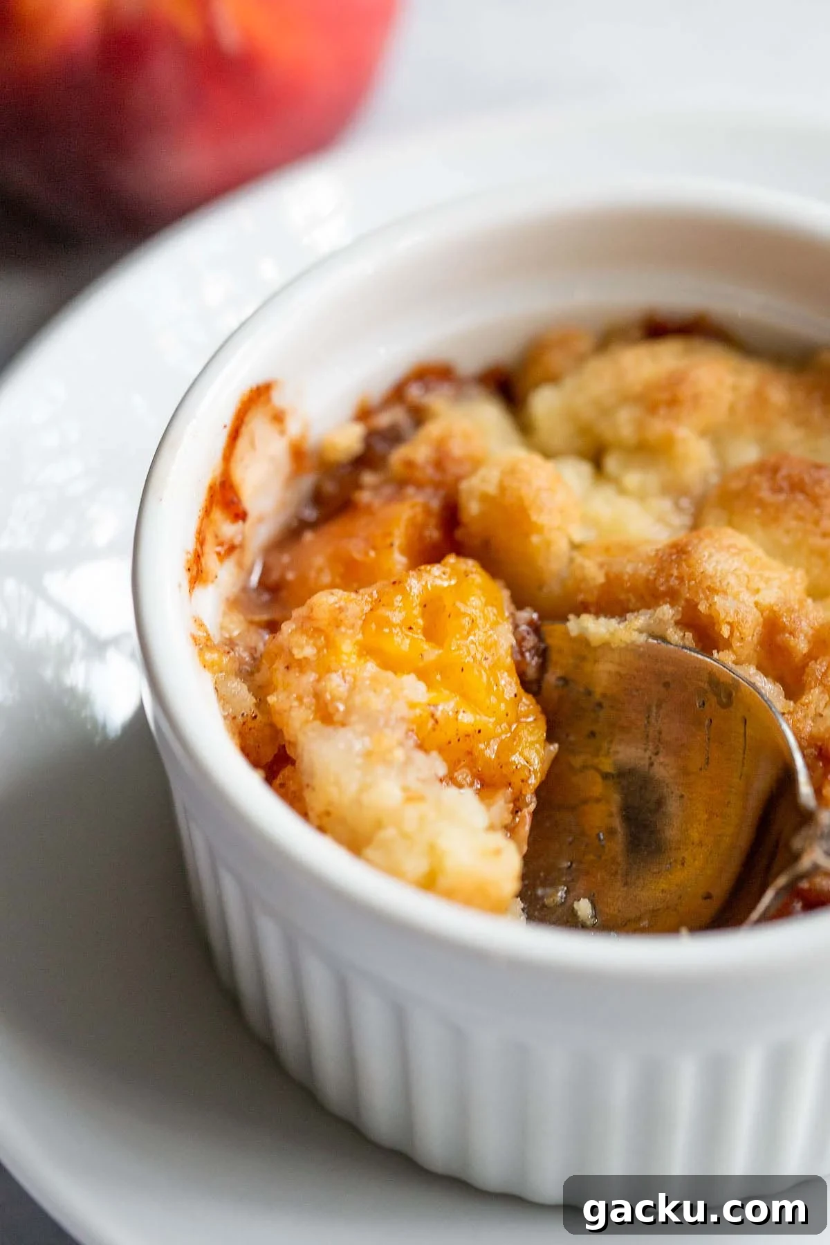 Peach cobbler in a ramekin.