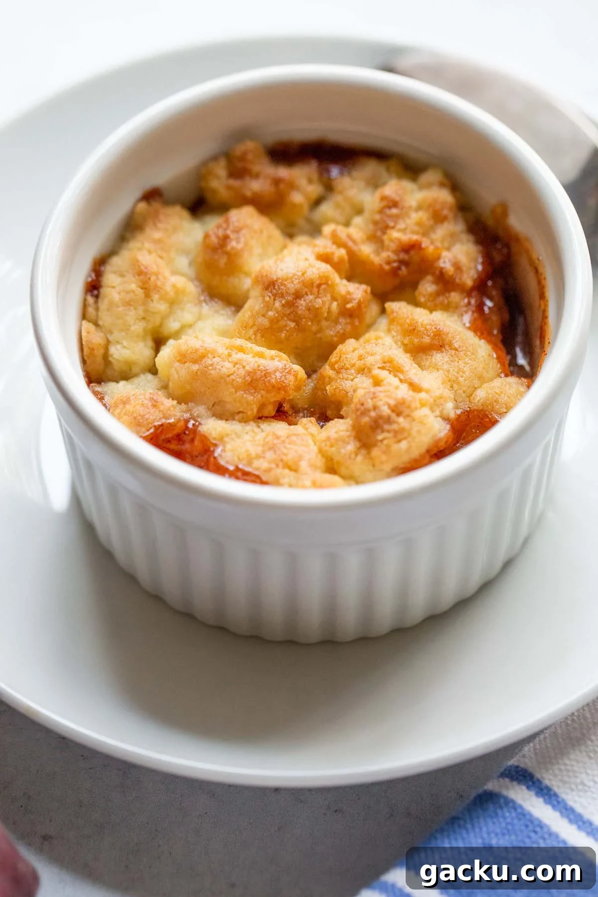 Peach cobbler in a ramekin.