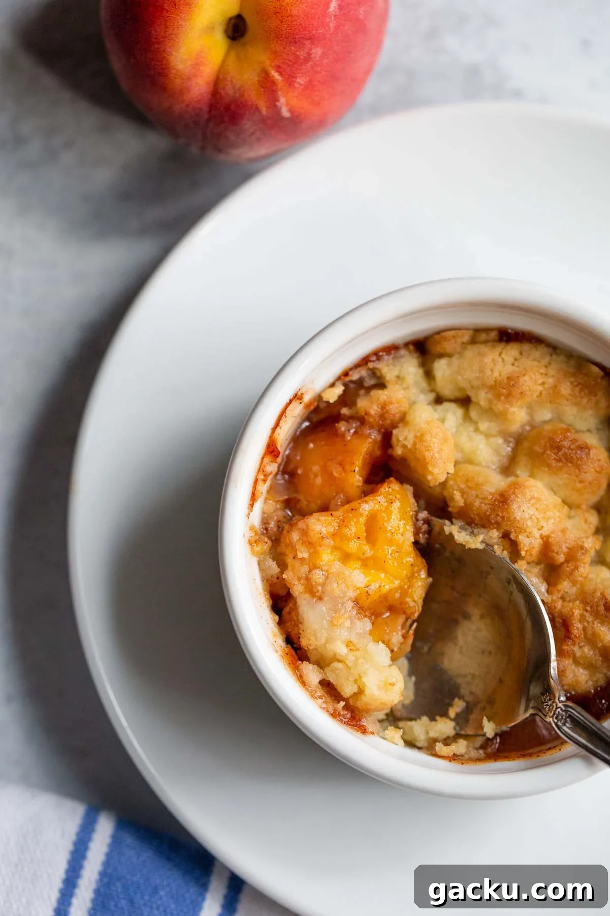 Peach cobbler in a ramekin.