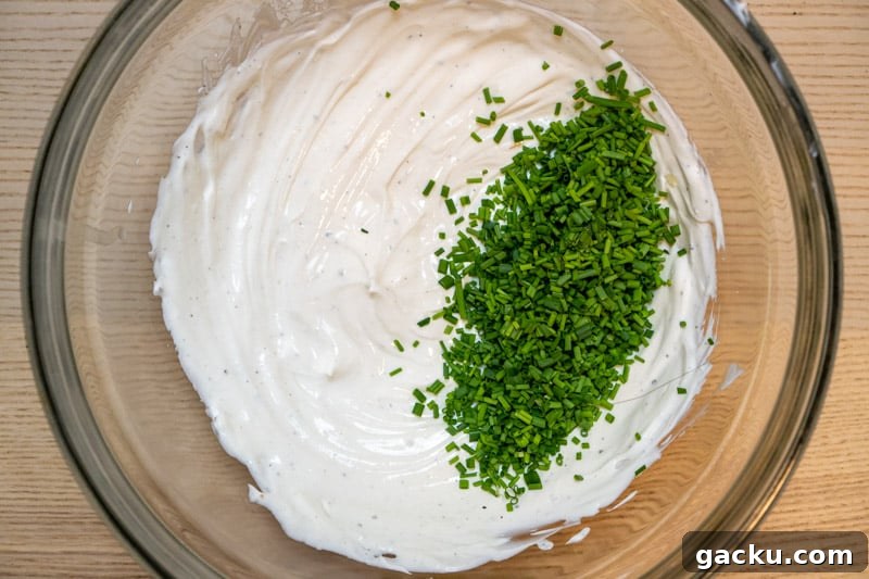 French Onion Dip Made Without Sour Cream — Tangy Creamy Recipe 4 Adding the yoghurt, ricotta and chives to a bowl