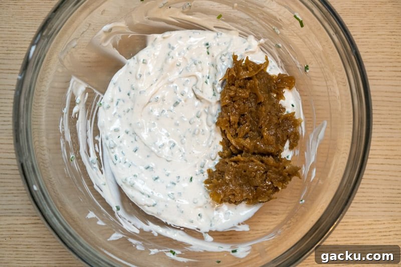 French Onion Dip Made Without Sour Cream — Tangy Creamy Recipe 5 Adding the caramalised onions to the bowl