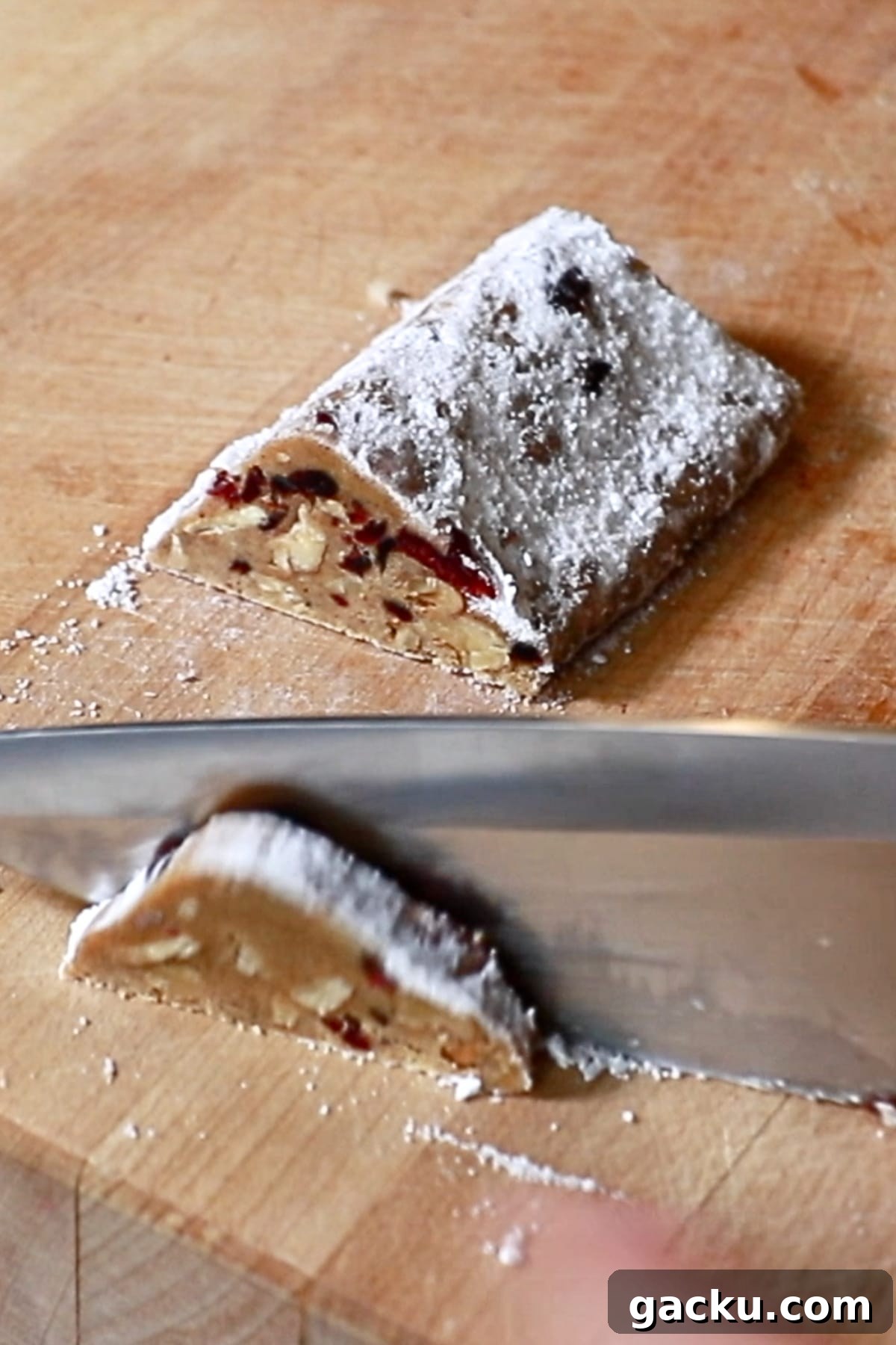 slicing stollen cookie dough with a knife