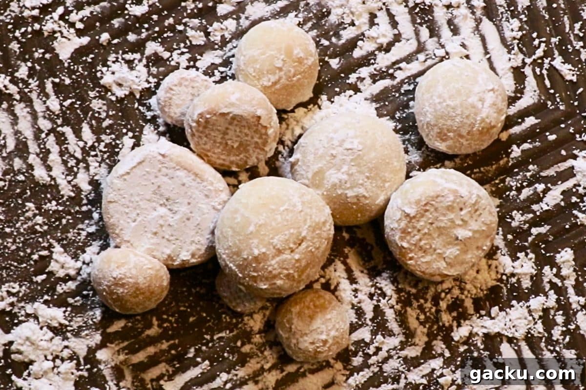 Snowball cookies on a baking sheet